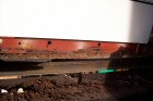 Rusted chassis under the driver's door.